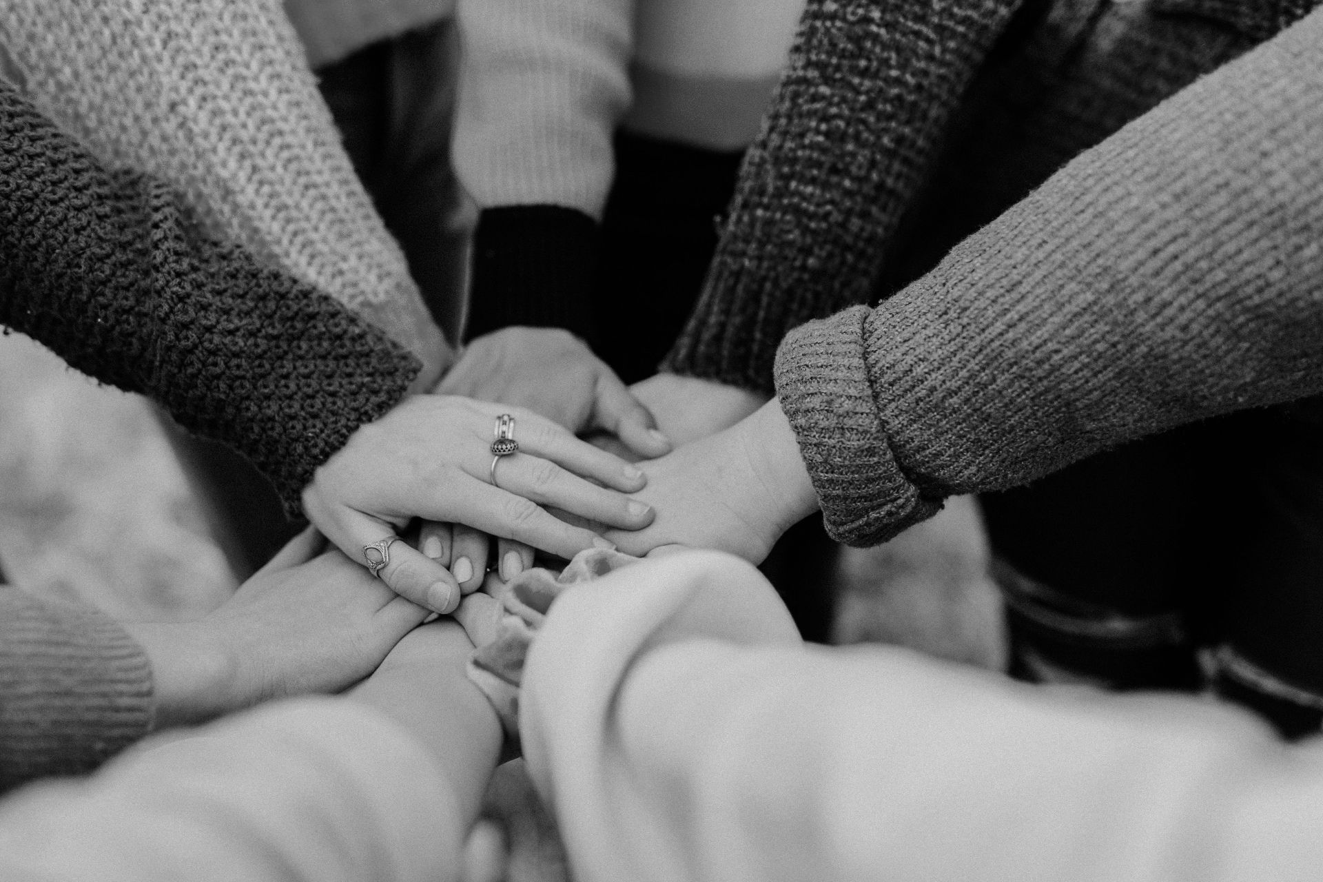 Hands coming together representing collaboration and unity